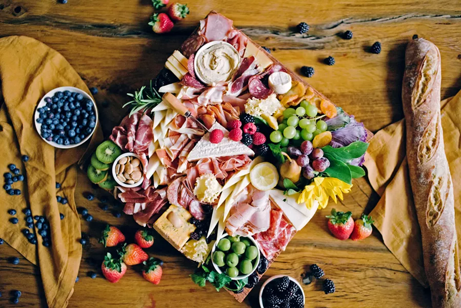 GRAZING Say so long to digging through your purse for oyster crackers and hello to grazing tasty curated boards at wineries and events. This was the year of the cheese and charcuterie trend, like this gorgeous spread at Halter Ranch Vineyard and Winery made by Paso-based Cured and Cultivated. - FILE PHOTO COURTESY OF CURED AND CULTIVATED
