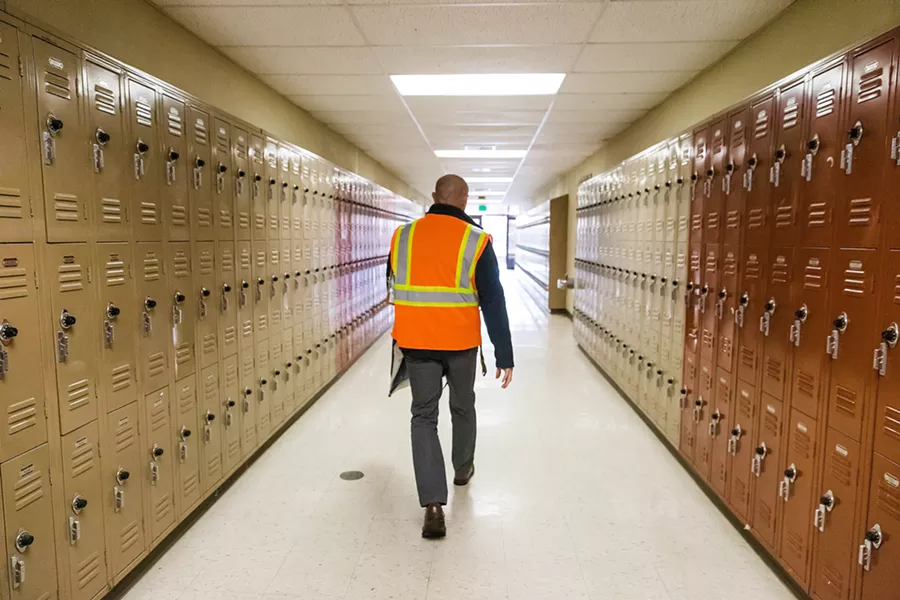 SURVIVAL INSTINCTS SLO High School Principal Leslie O'Connor walks the halls during a lockdown drill in January 2019. On Feb. 28 of this year, a scheduled earthquake drill at SLO High accidentally turned into a lockdown that students thought was real. - FILE PHOTO BY JAYSON MELLOM