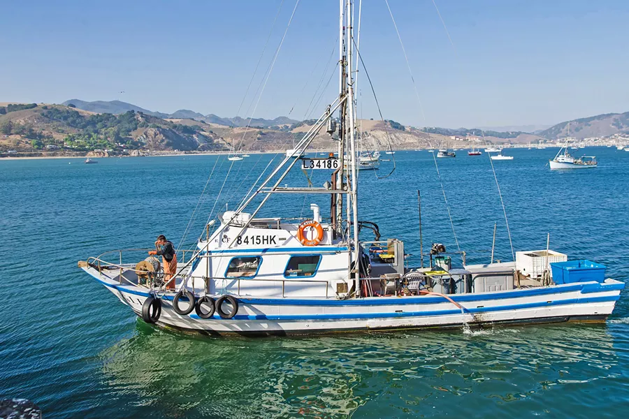 FISH OUT OF WATER Commercial fishing boats like this one are still allowed out on the water, but SLO County's public ramps in Morro Bay and Port San Luis are officially closed to recreational fishers and boaters. - FILE PHOTO BY JAYSON MELLOM