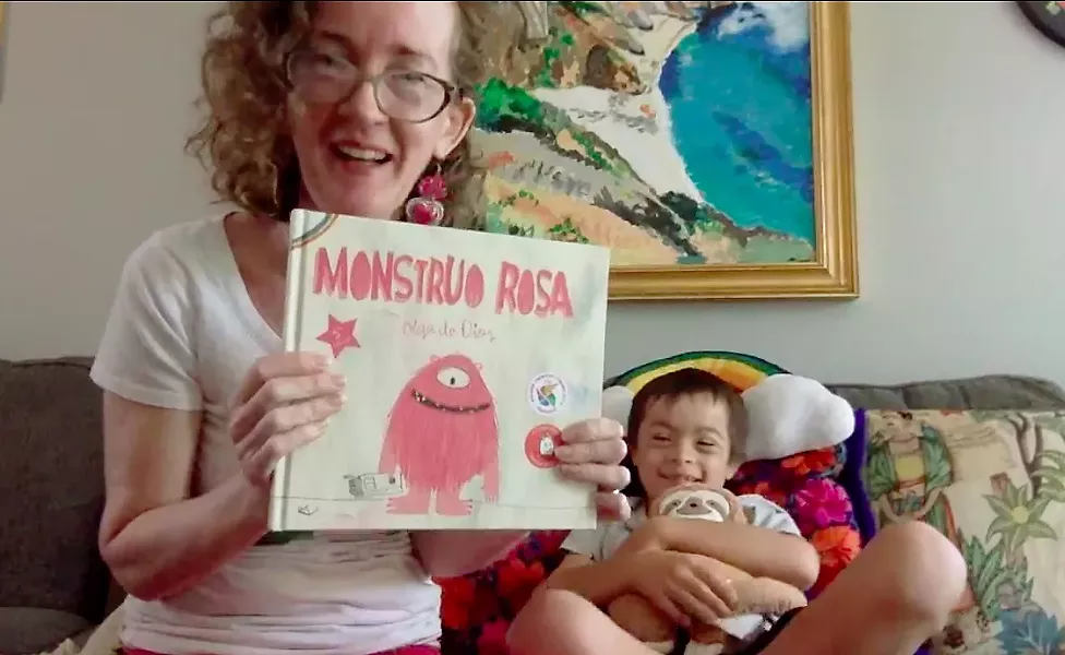 PARENTS HELPING PARENTS Family Resource Specialist Sara McGrath leads a virtual bilingual reading session with her 8-year-old son, Liam. McGrath works at Parents Helping Parents of SLO, an organization that helps connect the families of children with special needs to available resources. - SCREENSHOT FROM FACEBOOK