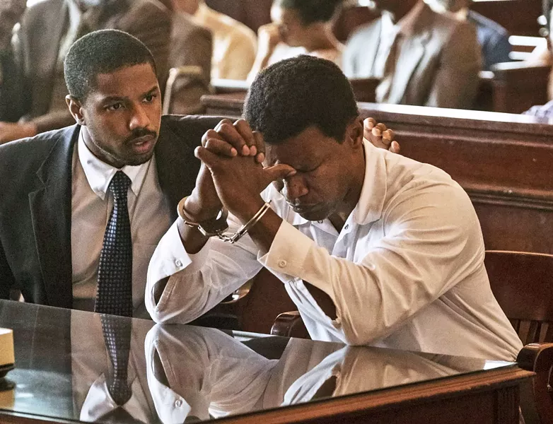 SETTING THE RECORD STRAIGHT Attorney Bryan Stevenson (Michael B. Jordan, left) faces off against a corrupt criminal justice system in his bid to have wrongly convicted murderer Walter "Johnny D" McMillian (Jamie Foxx) released from Alabama's death row, in the true story Just Mercy. - PHOTO COURTESY OF WARNER BROS. PICTURES