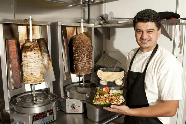 MAN WITH A PLAN … AND FOOD : Toni Tanous has made some big changes to the Sidewalk Market, including a Mediterranean deli. - PHOTO BY STEVE E. MILLER