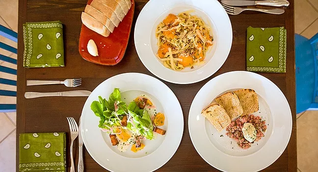 SPOON IT ON : Comfort meets creativity at Grover Beach’s The Spoon Trade. Thomas’ favorite part of the interview? Digging into fresh made sourdough bread smothered in butter. - PHOTO BY KAORI FUNAHASHI