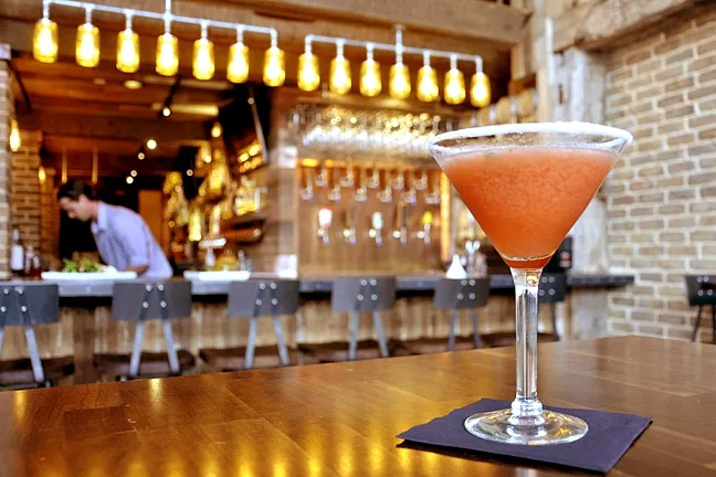 PRETTY IN PINK: The Mason Bar’s twist on the lemon drop features strawberries and basil. It’s refreshingly not sweet with a sugared rim. - PHOTO BY CAMILLIA LANHAM