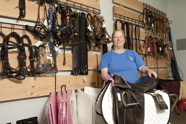 PLETHORA OF LEATHER : At The Tack Room in Paso Robles, Laurie Ridgeway showcases many of her products available for all you cowboys and cowgirls out there. - PHOTO BY STEVE E. MILLER