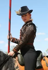 THE LADY KNIGHT: Katrina Saunders, a member of the jousting troupe Knights of the Crimson Rose, will display her mad jousting skills July 20 and 21 at the Central Coast Renaissance Festival. - PHOTO COURTESY OF RICK SMITH