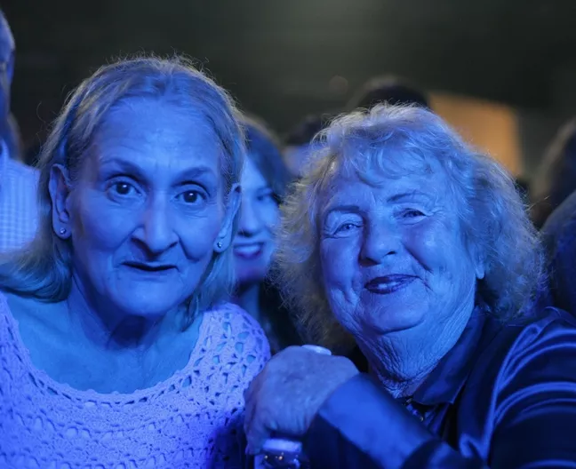 DOWN OFF THE MOUNTAIN: Linda and Muriel may not have been the youngest people at the show, but they were the most ambitious—they had front row center stage position at the concert. - PHOTO BY GLEN STARKEY
