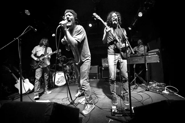 THEY'RE AN AMERICAN BAND! : Shannon Koehler (center left) and his band The Stone Foxes, play Saturday during the three-day Seven Sisters Fest, July 10 to 12, at El Chorro Regional Park. - PHOTO BY MIKE ROSATI