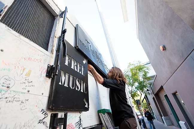 NICE SET: Jeffrey’s customized box truck, nicknamed Betsy, only takes about 10 minutes to get ready. For big shows, he’s installed a large projection screen to broadcast tunes and video to the bustling crowds. - PHOTO BY KAORI FUNAHASHI
