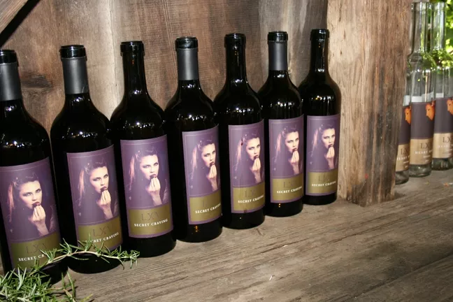 STAR OF THE SHOW: Season 9 Bravo Top Chef Dakota Weis, who serves as Executive Chef at the W Hotel in Los Angeles, is emblazoned - on LXV’s newest release, 2013 Secret Craving. The chef signed several bottles at the winery’s release party, held in last month in Paso Robles. - PHOTO BY HAYLEY THOMAS