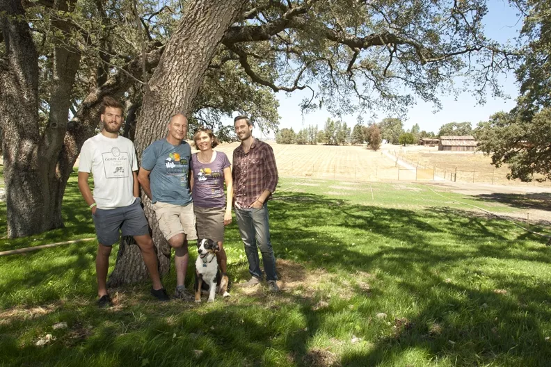 GRAPE MUSIC: Over the shoulders of the Udsen family (Left to Right: Max, Niels, Bimmer, Luke, and Ruby the dog) lies the location of the stage for the Beaverstock music festival at Castoro Cellars. - PHOTO BY STEVE E. MILLER