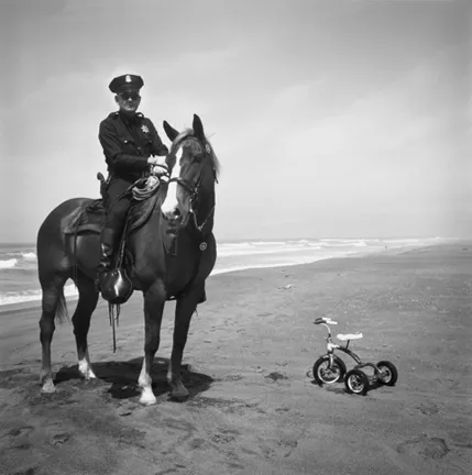 TRICYCLE POLICE : By 1964, visual non-sequiturs such as this one were already a hallmark of the photographer’s style. - PHOTO BY ARTHUR TRESS