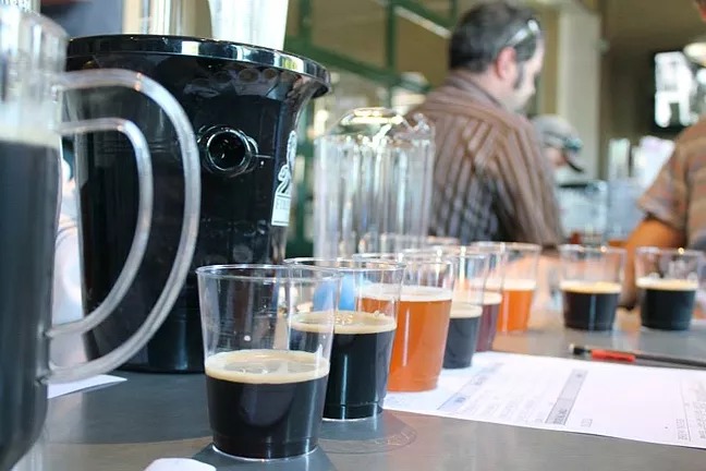 THE FINAL BLEND: At the start of harvest, a total of 13 local winemakers came together to create Firestone Walker Brewing Co.’s annual Anniversary Ale. - PHOTO COURTESY OF FIRESTONE WALKER BREWING CO.