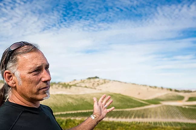 ENOUGH IS ENOUGH : Gianni Manucci, owner of Wild Coyote Estate Winery and Bed and Breakfast, is upset about a project on the property next door that includes new winery facilities and events. - PHOTO BY KAORI FUNAHASHI