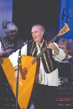 HE’S EITHER REAL SMALL OR THAT’S A BIG GUITAR : Take a sonic trip to Russian on April 4 when the Red Barn Community Music Series presents Big Rock Balalaikas in St. Benedict's Church. - PHOTO COURTESY OF BIG ROCK BALALAIKAS