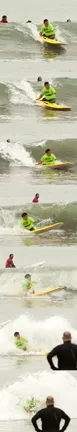CHARGING! : Triple amputee and British veteran Martin Pollock drops into a wave at Cayucos pier. - PHOTOS BY STEVE E. MILLER