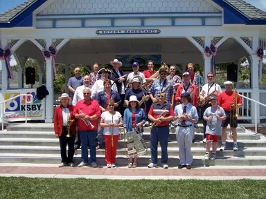 RED, WHITE AND TRUE BLUE: The Village Band will present a program of stirring patriotic and popular music while the South County Historical Society sets the mood with traditional red, white, and blue decorations, and period costumes at Arroyo Grande’s July 4 celebration. - PHOTO COURTESY OF THE VILLAGE BAND