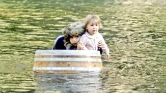 JUST AROUND THE RIVER BEND: In the midst of their adventure, JoJo and Avila find themselves riding down the river in a barrel, while being chased by an errant hobo. - PHOTO COURTESY OF BRIAN SCHMIDT AND ANN-MARIE PLASTINO