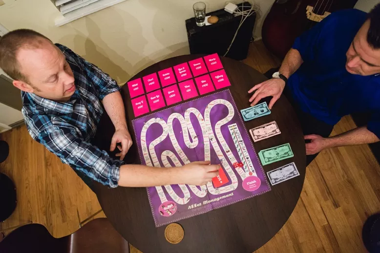 PLAYERS!: SLO Towners Forrestt Williams and Jason Main, the creators of A$$et Management, a Monopoly-like game with pimps trying to control the most hoes, will launch a crowd funding campaign in the - next few months. - PHOTO BY KAORI FUNAHASHI