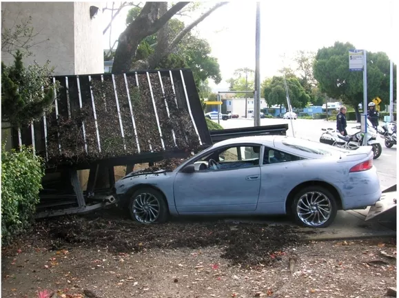 NOT A SCHEDULED STOP : This vehicle slipped from its restraints on a flat-bed truck and careened into a bus stop, causing roughly $5,000 in damages. - PHOTO COURTESY OF SAN LUIS OBISPO POLICE DEPARTMENT