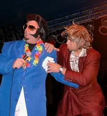 THANK YOU, THANKYOUVERYMUCH! : Tortelvis gets some flopsweat help from his personal assistant and towel boy Charlie Haj during a live performance of Dread Zeppelin, which performs at Sweet Springs Saloon on Aug. 14 as part of Wet Zeppelin, a five-day concert and wine series. - PHOTO COURTESY OF DREAD ZEPPELIN
