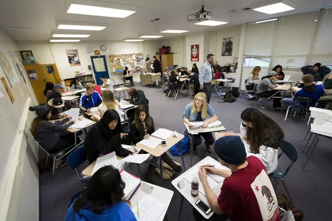 PODCLASS: Students in Michael Godsey’s 11th grade classroom analyze the various, narrative tools employed in the podcast 'Serial.' - PHOTO BY KAORI FUNAHASHI