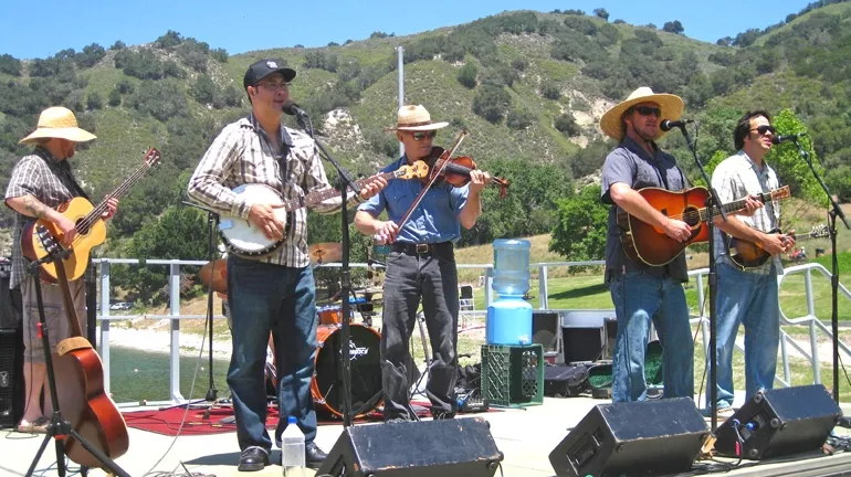 SWINGIN’ OUTSIDE : Cuesta Ridge brought their folksy tunes to a downright beautiful venue by the lakeshore. Zongo Allstars and Morning Rise also took the stage for the Outdoor Discovery Festival. - PHOTO BY NICK POWELL
