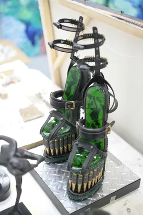 CRUEL SHOES : Festooned with bullets, hose clamps, and switchblades for heels, these shoes are to die for. - PHOTOS BY GLEN STARKEY