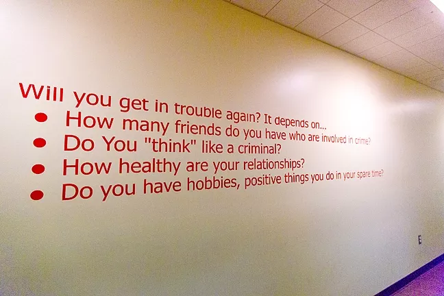 THOUGHT CRIMES: A sign inside the juvenile hall asks kids to consider their own risk of recidivism. - PHOTO BY KAORI FUNAHASHI