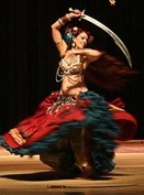 SWORDS AND SWIRLS :  Seba displays the vibrancy of costume and motion. - PHOTO COURTESY OF WENDY OLIVER