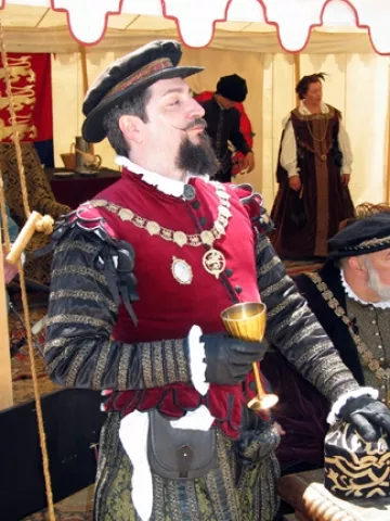 EARL IN THE HEAT : Rydell Downward portrays the Earl of Leicester at the Central Coast Renaissance Festival. Many of the event's organizers say they used to play nobles, but turned to peasant costumes because they're more comfortable in the heat.