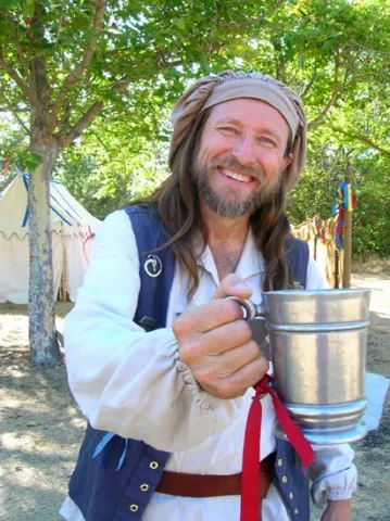 CHEERS : Michael Teubner plays the character of Winston Waters, a former sailor who sings and interacts with visitors to the Central Coast Renaissance Festival.