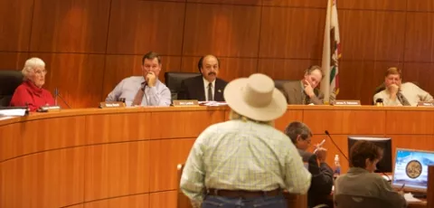 PROPERTY RIGHTS THROWDOWN : Farmers, ranchers, hikers, bikers, and some community members crossing those lines argued all day in Supervisors chambers on Nov. 14 over proposed amendments to the General Plan. The new public code, once solidified, will direct where and how public trails are laid in San Luis Obispo County over the next 10 to 20 years. Speakers present included heads of the Farm Bureau and SLO Bicycle Coalition Executive Director Adam Fukushima. - PHOTO BY JESSE ACOSTA