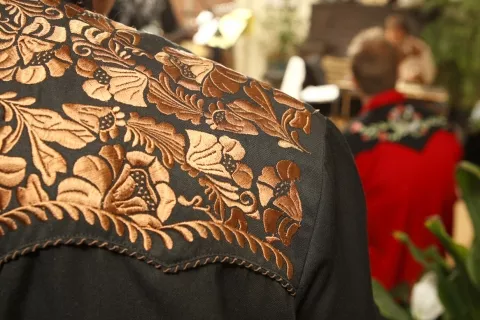 COWBOY UP : Band organizer Paul Brown searched online to buy embroidered western shirts for every band member to help form the as-yet-unknown-band's image. - PHOTO BY STEVE E. MILLER