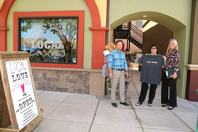 LOVE LOCAL: Wendy Estus (center), with Love Local Boutique, asks Community Development Director Phil Dunsmore (left) and Deputy City Manager Terrie Banish (right) if the North County Farmers Market will return to downtown. - PHOTO BY DYLAN HONEA-BAUMANN