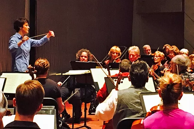 LEAD THE WAY: Laura Jackson, the current music director of the Reno Philharmonic, conducts the San Luis Obispo Symphony during a rehearsal for its upcoming Classics in the Cohan concert on Feb. 6. - PHOTO COURTESY OF THE SAN LUIS OBISPO SYMPHONY
