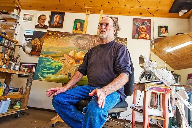 MAKING A STATEMENT : Arroyo Grande artist Mark Bryan, above, talks about his art at his tree house studio in Arroyo Grande. Behind him sits Devil’s Due, Meltdown at Diablo Canyon, depicting a natural disaster wreaking havoc at the local power plant. - PHOTO BY JAYSON MELLOM