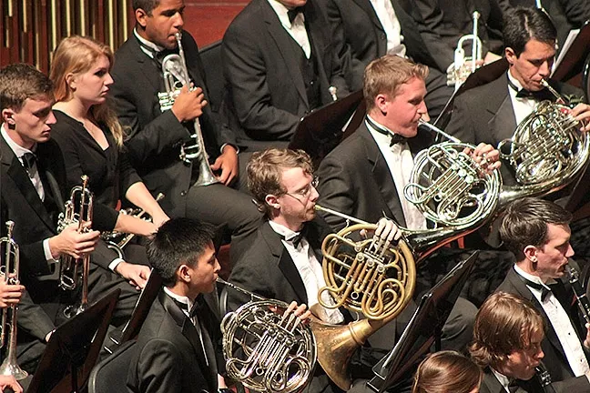BLOW, BABY, BLOW: Cal Poly’s 70-member Wind Ensemble and 80-member Wind Orchestra will play Cal Poly’s Winter Band Concert on March 17, in Harman Hall of the Performing Arts Center. - PHOTO COURTESY OF CAL POLY