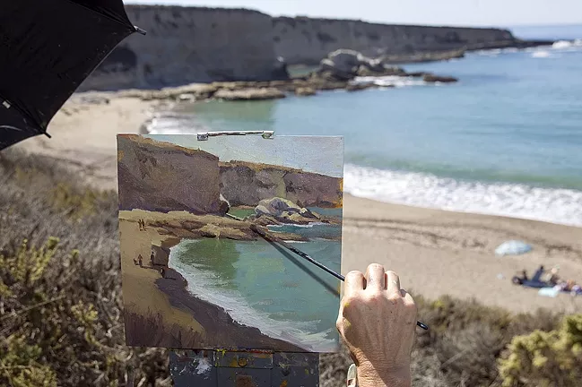 PICTURE PERFECT VIEW: Artist Rita Pacheco returned to SLO County after 10 years to capture the view from Spooners Cove at Montaña de Oro for Studios on the Park’s Wet Painting Invitational. - PHOTO BY JAYSON MELLOM