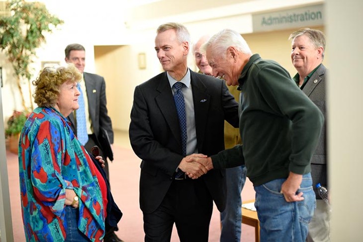 Congressman Steve Russell shakes hands with Don Spurgin before a town hall meeting at The Village Municipal Building, Tuesday, March 8, 2016. - GARETT FISBECK
