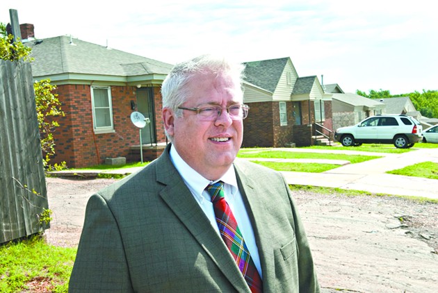 Mark Gillett, executive director for the Oklahoma City Housing Authority, on the scene at the public housing project they are calling the northeast duplexes, a large area containing at least 4 streets, including N.E. 27th where he is pictured.