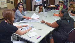 Women participants in the ReMerge program work at the non-profit's new facilities inside the building which houses Northcare, at 1140 N. Hudson Avenue. mh