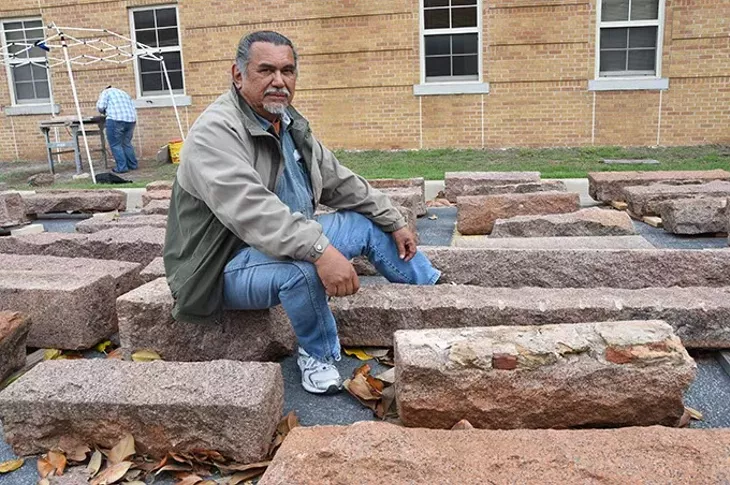 Artist-in-residence at USAO, Jesus Moroles, with granite blocks being used in the construction of Coming Together Park on the campus in Chickasha. mh