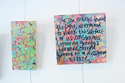Kerri Shadid, Skirvin Hilton's Artist-in-Residence, creates poems on paintings, shown on the wall of her Skirvin studio.  mh