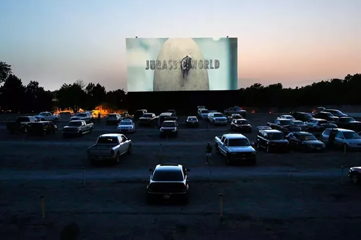 Patrons relax in the glow of high-definition film projection at Winchester Drive-In. (Garett Fisbeck)