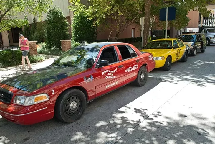 Cabs lined up waiting for rides along Main Street in Downtown OKC. - MARK HANCOCK