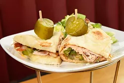 Classic Turkey Piadine sandwich at Upper Crust Pizza, Friday, March 18, 2016. - GARETT FISBECK