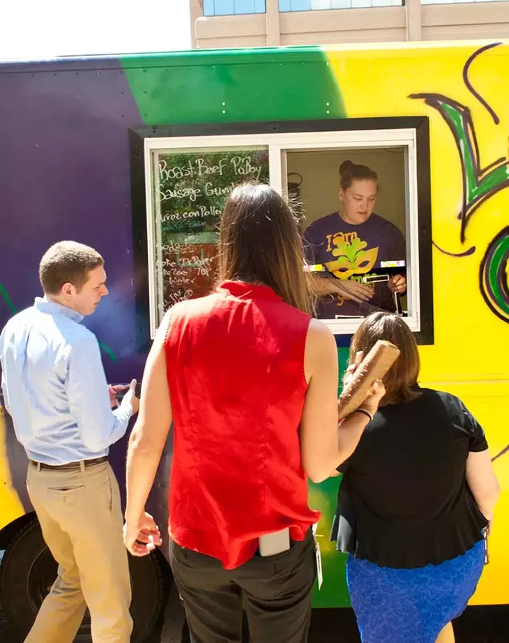 Rachel Fontanez works the window at the La Gumbo Ya Ya food truck, shown at corporate lunch event. (Mark Hancock)