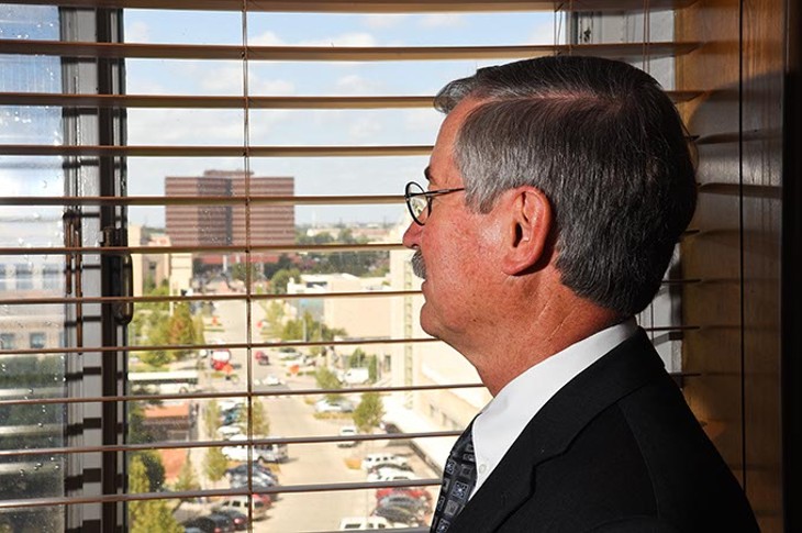 Judge Ray Elliott looks out of his office window in the Oklahoma County Courthouse towards the Oklahoma Coutny Jail, 9-16-15. - MARK HANCOCK