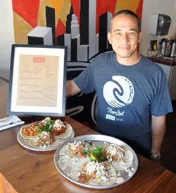 Ed Koch poses in his restaurant, Union Tacos in downtown Guthrie, Okla. Lauren Hamilton